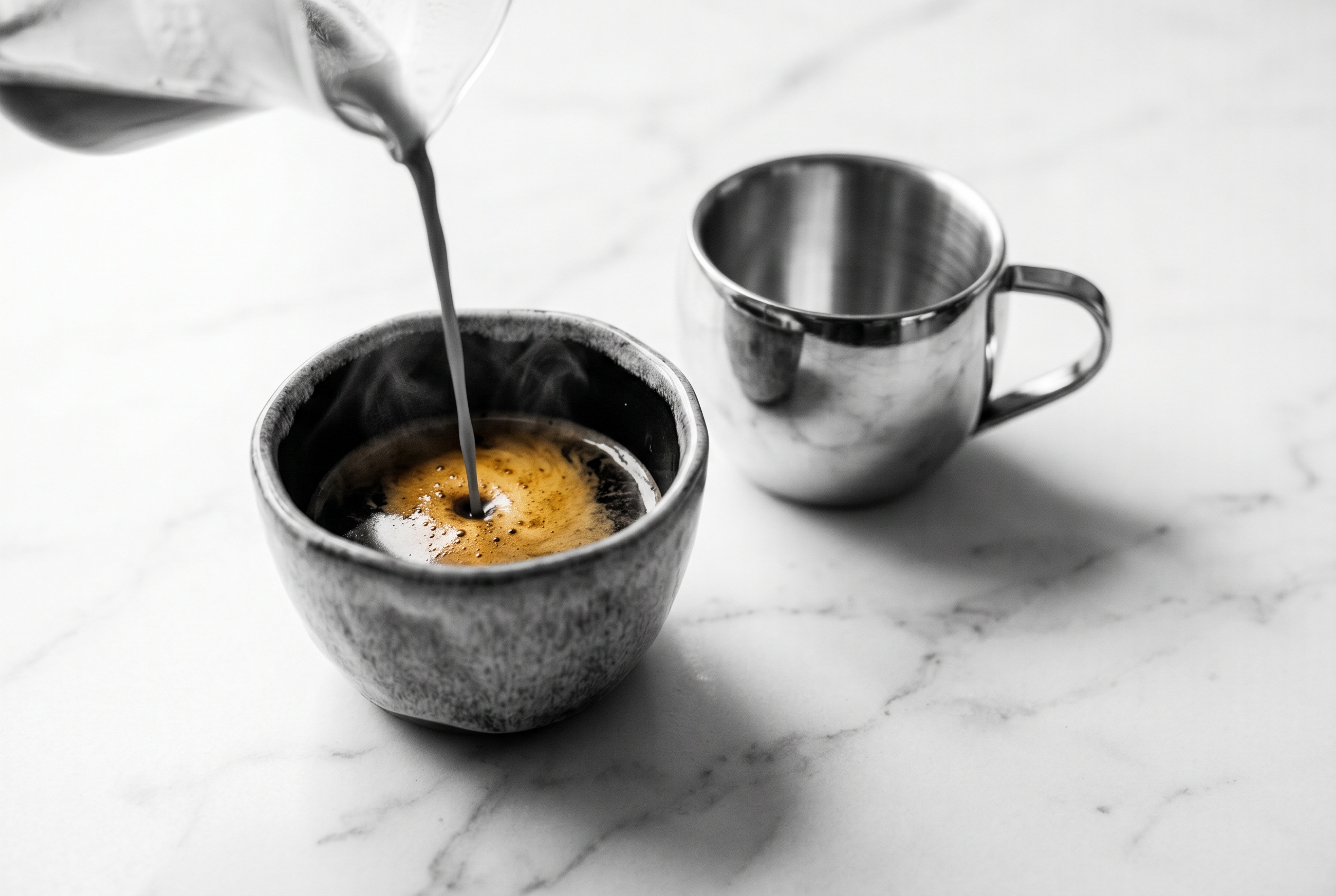 Espresso being pulled into a ceramic cup